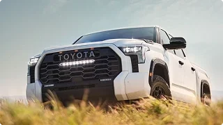 White Toyota Tundra TRD Pro parked in tall golden grass