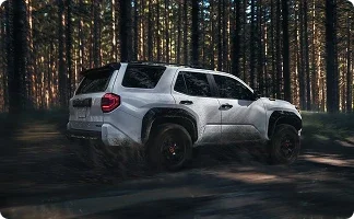 2026 Jeep Wrangler four-door on unpaved ground