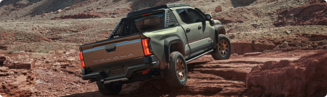 2026 Toyota Tacoma Trailhunter climbing over red desert rock